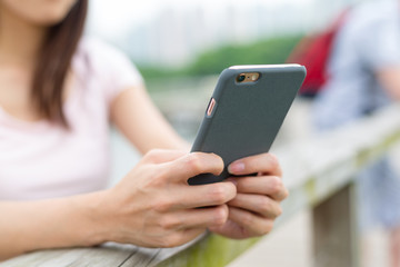 Woman texting on her cell phone