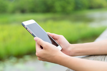 Woman texting with her phone