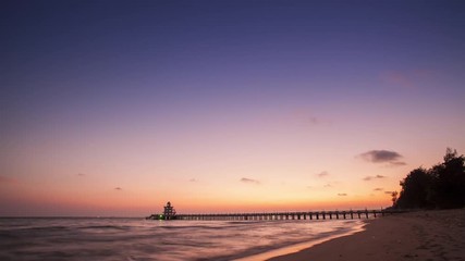 4K time lapse 24 fps pier in colorful twilight.