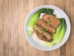 Roasted Pork with Bok Choy, Pak Choi Cabbage and rice on wood ba
