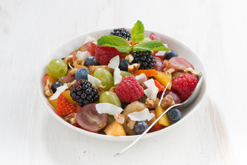 fruit salad on white wooden table