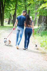 Young couple in love,walking and enjoy in park with his dogs