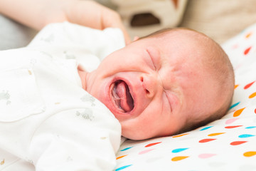 Newborn baby screaming in pain with colic