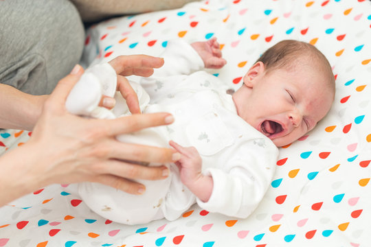 Newborn baby screaming in pain with colic