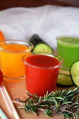 Healthy fresh orange, tomato and cucumber smoothie.