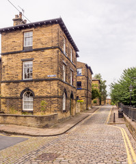 Fototapeta na wymiar Typical Northern terrached houses and back streets at Saltaire, Bradford, West Yorkshire, UK
