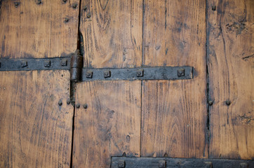 Medieval wood door with metal decorations vintage look
