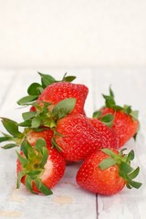 Strawberries on the wooden background