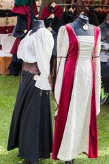Fototapeta na wymiar Medieval dresses at a medieval market