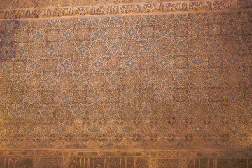 Wall detail of Alhambra in Granada. 600 years old arabic art. UNESCO heritage. South of Spain. - obrazy, fototapety, plakaty