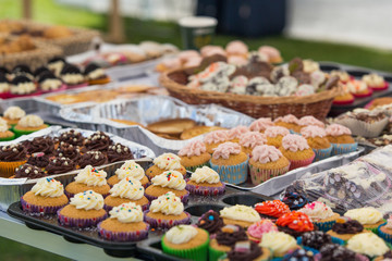 Selection of home made buns, muffins and cup cakes on the food market
