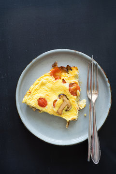 Omelet with cherry tomatoes and shiitake mushrooms