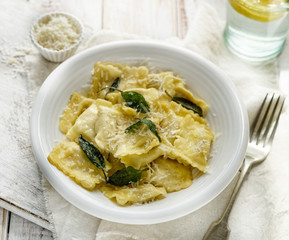Ravioli with sage butter sprinkled with grana padano cheese