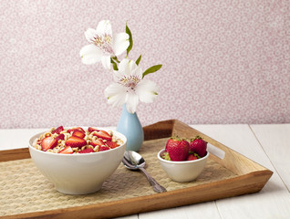 cereal bowl with strawberres in a tray