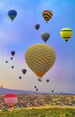 Obraz premium adventure Hot Air Balloons In The sunset Mountain