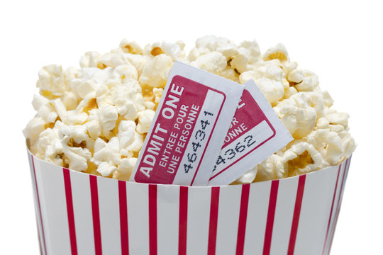 close up image of popcorn with movie ticket