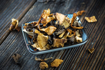 Dried mushroom on wooden background