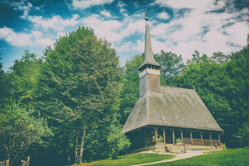 Fototapeta na wymiar Traditional Romanian Wooden Church In Forest