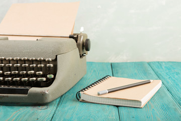 writer's workplace - wooden desk with typewriter