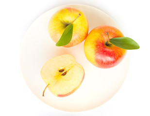 Gala apples with green leaves