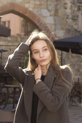 Beautiful young  model in a grey coat