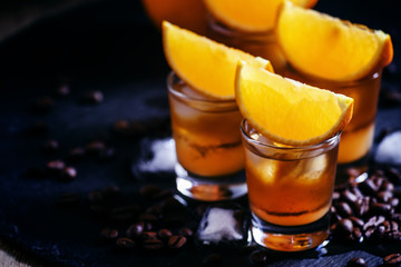 Сocktail bumblebee with orange juice, caramel syrup and espress