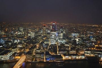 High angle cityscape of river Thames and city lights at night, London, England, UK