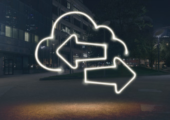 Glowing cloud symbol with opposite direction arrows in city at night