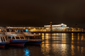 View on Vasilevsky Island - Stock Exchange Building and Rostral columns. Night Photography.