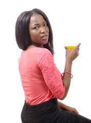 beautiful African woman drinking orange juice