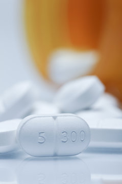 Close up of oval white pill, Vicodin