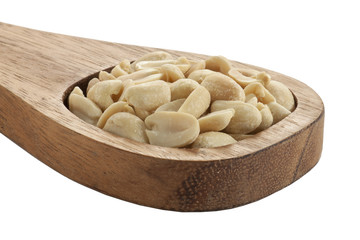 salted white peanuts in wooden spatula
