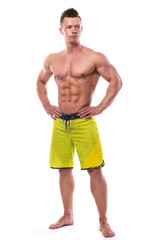 Young fitness model in green shorts