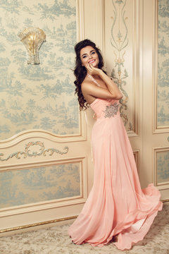 Smiling woman in pink dress