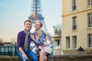 Romantic couple near the Eiffel tower in Paris, France