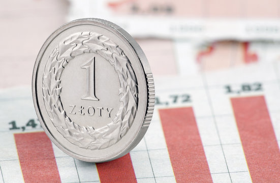 One Polish Zloty coin on newspaper chart
