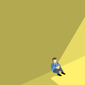 business man sitting alone against shadow wall with copyspace.