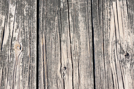 Three wooden plank vertical boards shown as textured background in natural gray