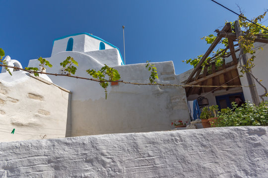 White chuch with vine in town of Parakia, Paros island, Cyclades, Greece