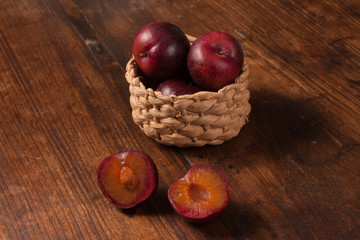 Fresh plums in the basket