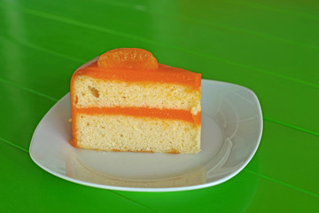 orange cake on white plate