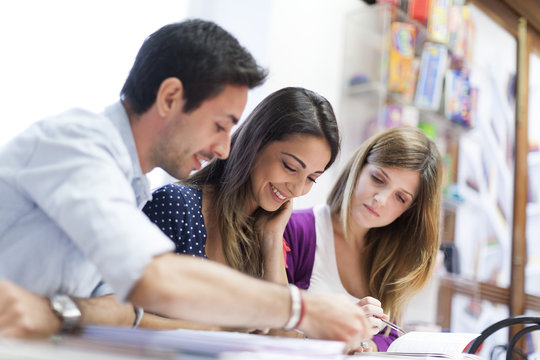 Three friends sitting together, studying