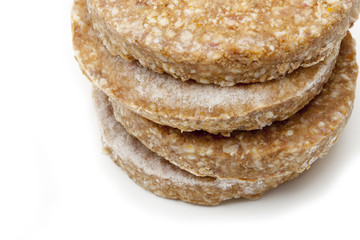 cropped view of frozen hamburger patty.