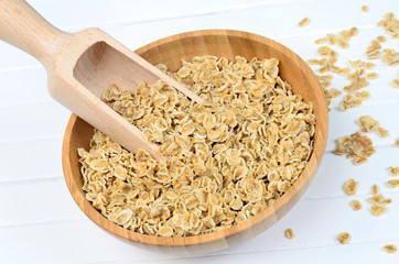 Bamboo bowl with oats and scoop