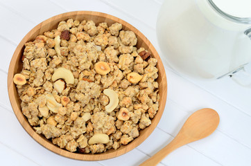 Delicious muesli in a bamboo bowl with milk