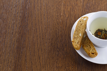 cropped image of lime tea and biscotti.
