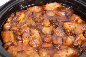 Vietnamese caramelized and simmered salmon and pork in a clay po