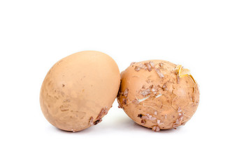 close up of broken eggs with eggshell stick rice