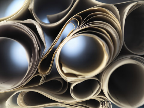 Full frame view through rolled up architectural drawings