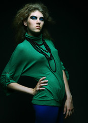 Fashion girl over dark background